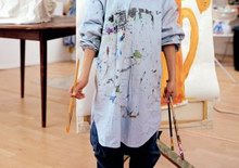 Boy wearing shirt stained with paint