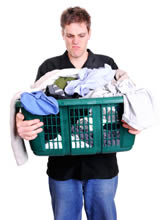 A man frustrated with doing the laundry