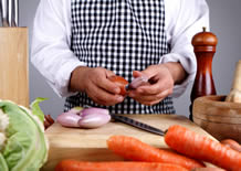 Man wearing apron while cooking and having fun
