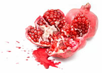 Smashed pomegranate with juices flowing