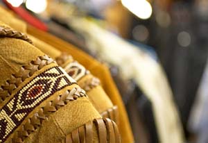 A suede female cowboy jacket with a fringe