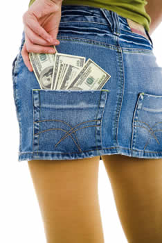 Woman wearing a jean skirt with money in her back pocket